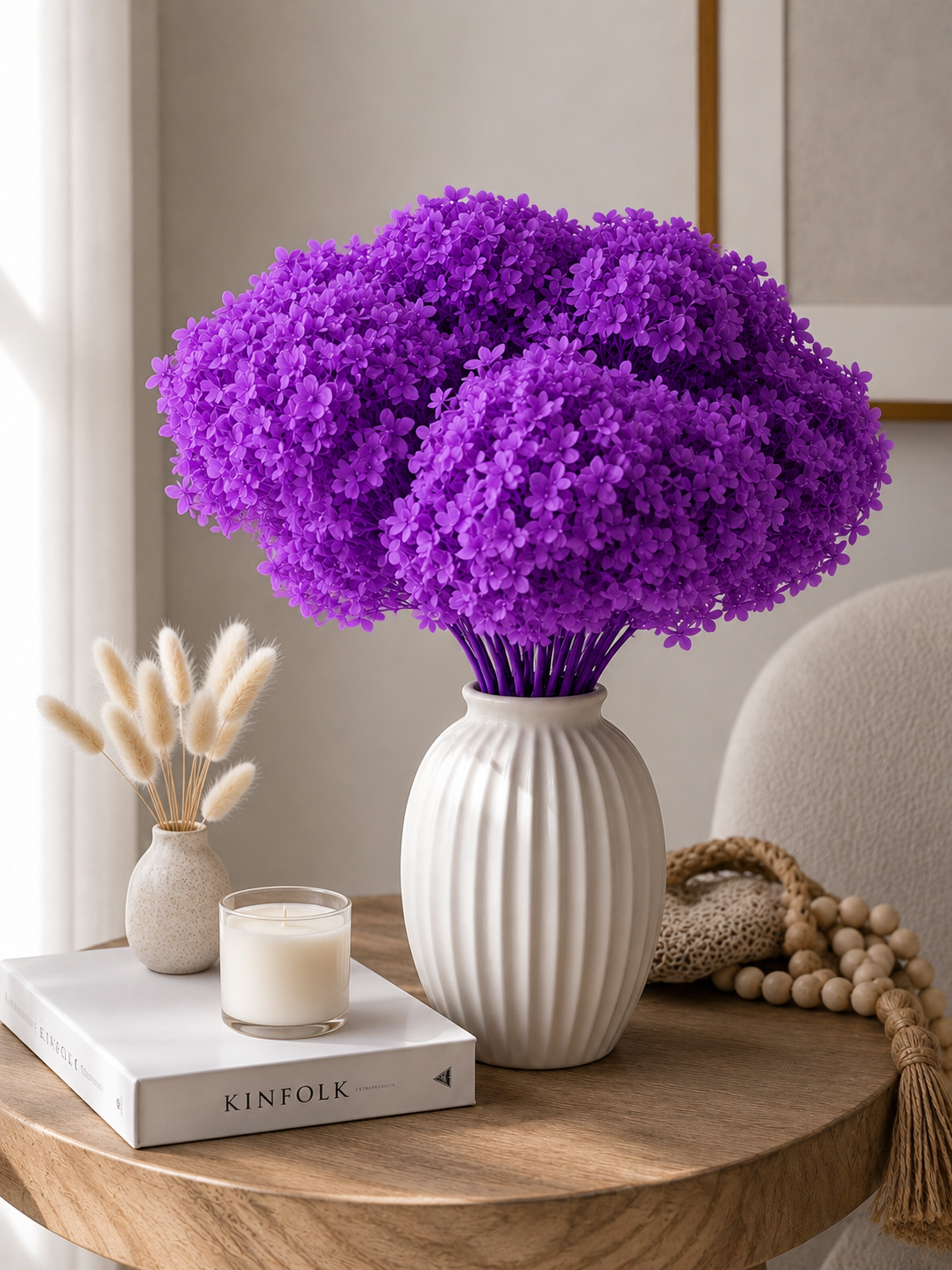 Vibrant Lilac hydrangea in a white vale on a table 
