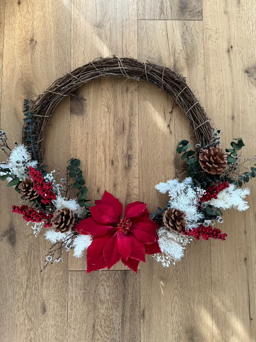 red flower circle wreath on floor