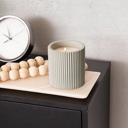 olive candle on display