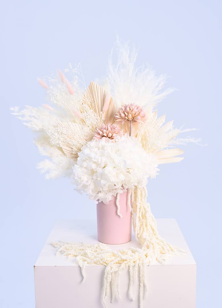Tall White Dried Flowers in a Pink Vase