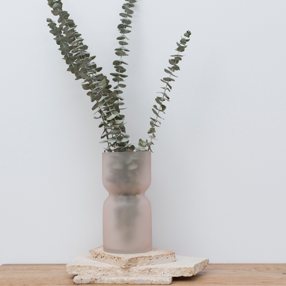 Gum in a pink glass vase