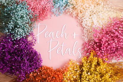 A display of our range of baby's breath colours. Arranged in a wreath shape around our logo plaque. 