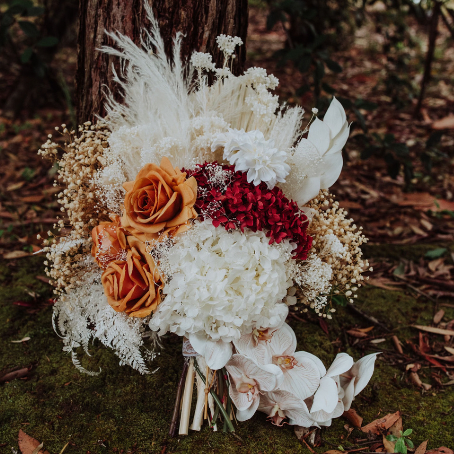 a silk and dried flower wedding bouqet