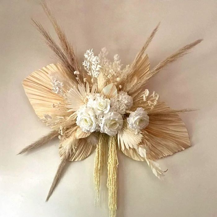 Dried Flower Wall Hanging with large neutral coloured palm leaves, pampas grass and ming fern with white roses and hydrangea. Large 100cm wide floral wall art.